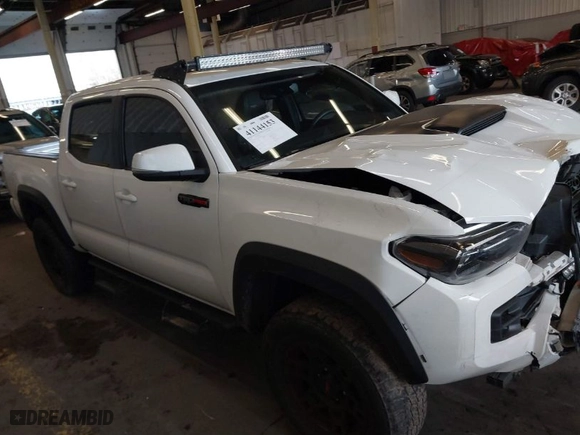 2019 Toyota Tacoma 4WD SR with VIN 5TFCZ5AN0KX209923, listed as a IAAI auction lot 41144153 with 50,605 mi miles. Bid and sale history available at carsss.com. Image 13.