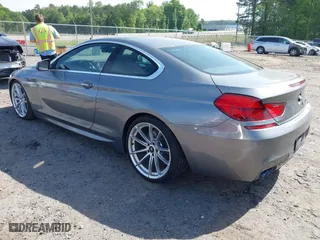 2012 BMW 6 Series 650i with VIN WBALX3C5XCC528484, listed as a IAAI auction lot 42080063 with 120,995 mi miles. Bid and sale history available at carsss.com. Image 3.