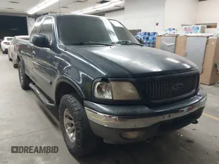 1999 Ford F-150 XL with VIN 1FTRX18L5XKB05347, listed as a IAAI auction lot 41885737 with 250,070 mi miles. Bid and sale history available at carsss.com. Image 1.