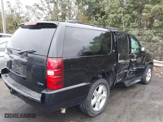 2011 Chevrolet Suburban LTZ with VIN 1GNSCKE02BR206544, listed as a IAAI auction lot 41159341 with 218,202 mi miles. Bid and sale history available at carsss.com. Image 4.