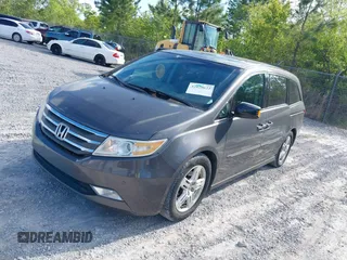 2012 Honda Odyssey Touring с VIN 5FNRL5H93CB133288, выставлен на аукционе IAAI как лот 42020622 с пробегом 184 077 миль миль и . История ставок и продаж доступна на DreamBid. Изображение 2.
