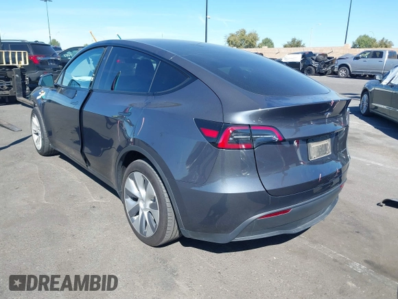 2023 Tesla Model Y Long Range with VIN 7SAYGAEE8PF976969, listed as a IAAI auction lot 41877784 with 25,896 mi miles. Bid and sale history available at carsss.com. Image 15.