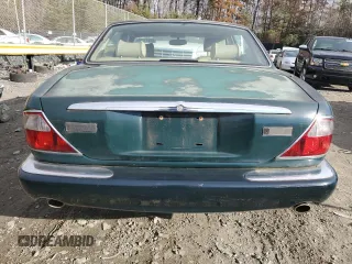1998 Jaguar XJ with VIN SAJHX1241WC839104, listed as a Copart auction lot 81911744 with 61,956 mi miles and Clean title. Bid and sale history available at DreamBid. Image 6.