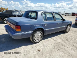 1993 Dodge Spirit z VIN 1B3XA46K0PF638477, wystawiony jako Copart lot #75710534 z przebiegiem 50 637 mil mil oraz Szkody całkowita. Historia ofert i sprzedaży dostępna na DreamBid. Obrazek 3.
