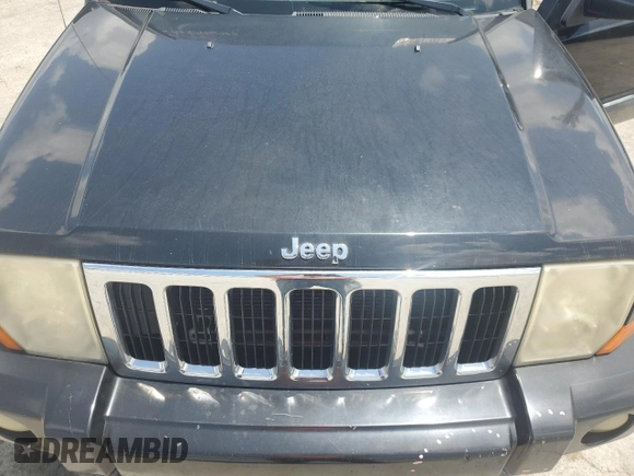 2008 Jeep Commander Sport z VIN 1J8HH48K58C126172, wystawiony jako Copart lot #61961285 z przebiegiem 235 022 mil mil oraz Szkoda całkowita • Salvage title. Historia ofert i sprzedaży dostępna na DreamBid. Obrazek 11.