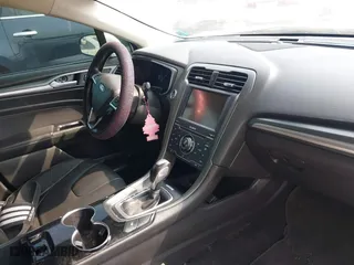 2014 Ford Fusion Titanium Hybrid with VIN 3FA6P0RU0ER329063, listed as a IAAI auction lot 40072913 with 210,274 mi miles. Bid and sale history available at carsss.com. Image 5.