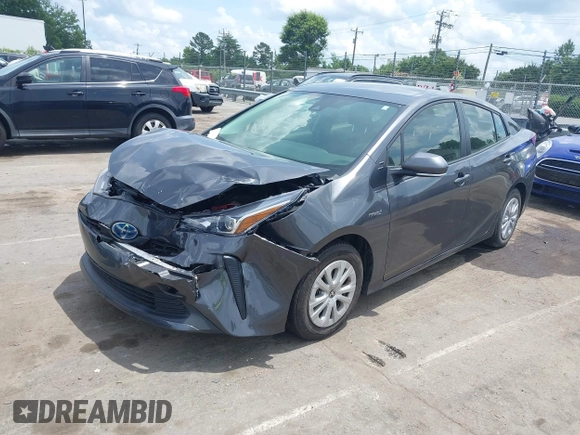 2021 Toyota Prius L Eco z VIN JTDKAMFU3M3152785, wystawiony jako IAAI lot #42501351 z przebiegiem 60 489 mil mil oraz . Historia ofert i sprzedaży dostępna na DreamBid. Obrazek 2.