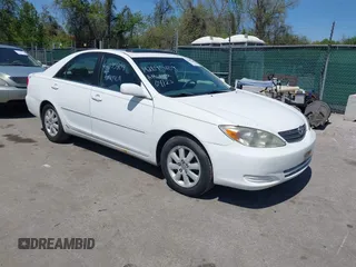 2002 Toyota Camry XLE z VIN 4T1BF32K72U030756, wystawiony jako IAAI lot #42095409 z przebiegiem 251 422 mil mil oraz . Historia ofert i sprzedaży dostępna na DreamBid. Obrazek 1.