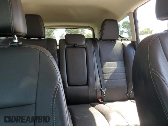 2015 Ford Escape Titanium with VIN 1FMCU0J97FUC80446, listed as a Copart auction lot 58749895 with 106,890 mi miles and Salvage title. Bid and sale history available at DreamBid. Image 10.