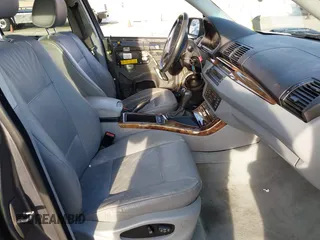 2003 BMW X5 3.0i with VIN 5UXFA53573LV83812, listed as a IAAI auction lot 41590046 with 166,841 mi miles. Bid and sale history available at carsss.com. Image 5.