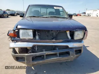1999 Nissan Frontier XE with VIN 1N6DD26S9XC307893, listed as a Copart auction lot 66045605 with 239,269 mi miles and Salvage title. Bid and sale history available at DreamBid. Image 5.