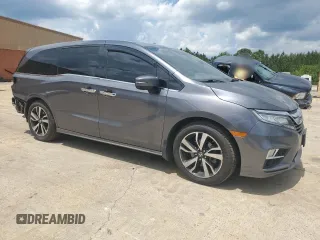 2018 Honda Odyssey Elite with VIN 5FNRL6H96JB015464, listed as a Copart auction lot 56911075 with 120,868 mi miles and Clean title. Bid and sale history available at DreamBid. Image 4.