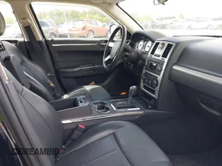 2009 Chrysler 300 Touring with VIN 2C3KA53V99H584082, listed as a IAAI auction lot 42026860 with 147,558 mi miles. Bid and sale history available at carsss.com. Image 5.