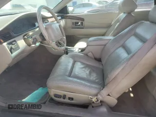 1998 Cadillac Eldorado z VIN 1G6EL12YXWU610918, wystawiony jako Copart lot #57309075 z przebiegiem 168 228 mil mil oraz Szkoda całkowita • Salvage title. Historia ofert i sprzedaży dostępna na DreamBid. Obrazek 7.