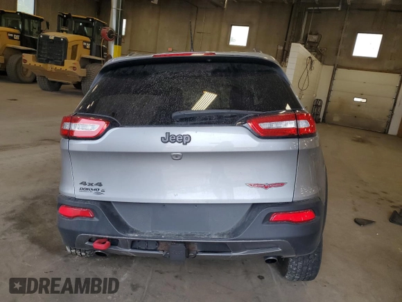 2014 Jeep Cherokee Trailhawk with VIN 1C4PJMBSXEW213981, listed as a Copart auction lot 60440495 with 136,612 mi miles and Salvage title. Bid and sale history available at DreamBid. Image 6.
