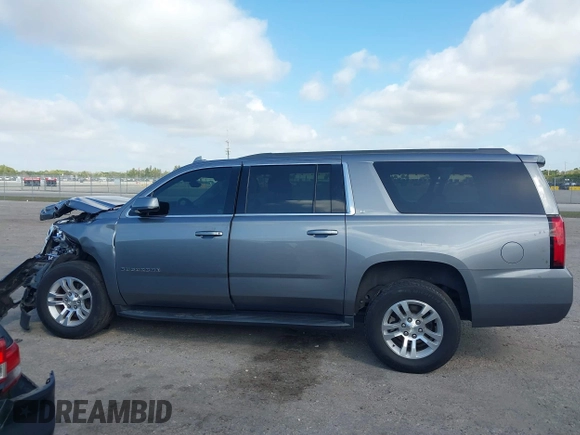2020 Chevrolet Suburban LT z VIN 1GNSCHKC8LR157188, wystawiony jako IAAI lot #41578614 z przebiegiem 82 566 mil mil oraz . Historia ofert i sprzedaży dostępna na DreamBid. Obrazek 14.