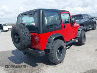 2002 Jeep Wrangler X with VIN 1J4FA39S02P739211, listed as a IAAI auction lot 41665910 with 144,118 mi miles. Bid and sale history available at carsss.com. Image 4.