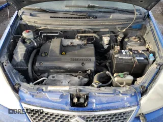 2005 Suzuki Aerio SX z VIN JS2RC61H655300809, wystawiony jako Copart lot #42507415 z przebiegiem 273 937 mil mil oraz Szkoda całkowita • Salvage title. Historia ofert i sprzedaży dostępna na DreamBid. Obrazek 11.