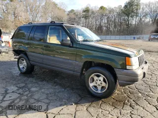 1996 Jeep Grand Cherokee with VIN 1J4EZ58S9TC148692, listed as a Copart auction lot 87730075 with Not provided miles and Salvage title. Bid and sale history available at DreamBid. Image 4.