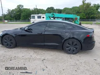 2022 Tesla Model S with VIN 5YJSA1E51NF472152, listed as a IAAI auction lot 42625943 with 60,290 mi miles and . Bid and sale history available at DreamBid. Image 13.