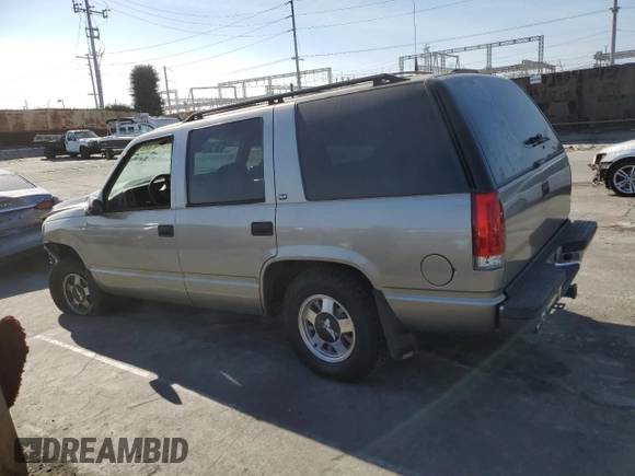 1999 GMC Yukon with VIN 1GKEC13R9XJ704929, listed as a Copart auction lot 89097295 with 87,478 mi miles and Salvage Title. Bid and sale history available at carsss.com. Image 2.