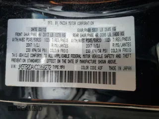 2012 Mazda CX-9 Grand Touring z VIN JM3TB2DAXC0358272, wystawiony jako Copart lot #60703665 z przebiegiem 278 558 mil mil oraz Szkoda całkowita • Salvage title. Historia ofert i sprzedaży dostępna na DreamBid. Obrazek 13.