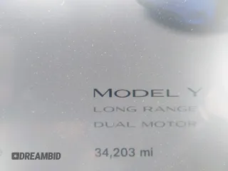 2023 Tesla Model Y Long Range with VIN 7SAYGDEE2PF696336, listed as a IAAI auction lot 41894686 with 34,203 mi miles. Bid and sale history available at carsss.com. Image 15.