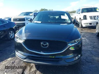 2021 Mazda CX-5 Touring with VIN JM3KFBCM9M0483082, listed as a IAAI auction lot 41305127 with 42,926 mi miles. Bid and sale history available at carsss.com. Image 12.