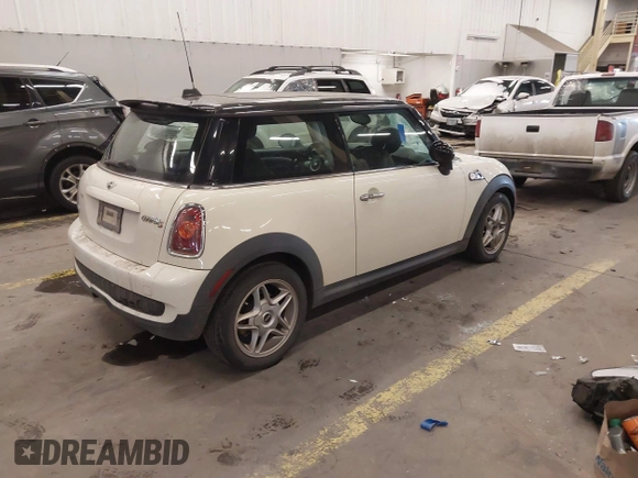 2009 MINI Hardtop S with VIN WMWMF73509TW85898, listed as a IAAI auction lot 41559954 with 97,186 mi miles and . Bid and sale history available at DreamBid. Image 4.