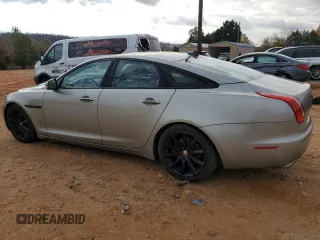 2014 Jaguar XJ with VIN SAJWA1CZ5E8V71971, listed as a Copart auction lot 82116114 with 127,164 mi miles and Salvage Title. Bid and sale history available at DreamBid. Image 2.