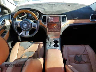 2011 Jeep Grand Cherokee Overland with VIN 1J4RS6GG7BC665979, listed as a Copart auction lot 83394214 with 216,988 mi miles and Salvage Title. Bid and sale history available at DreamBid. Image 8.