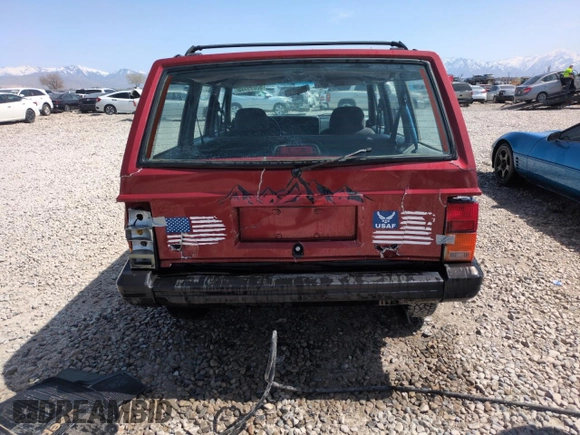 1996 Jeep Cherokee Sport with VIN 1J4FJ68S6TL171056, listed as a Copart auction lot 52099555 with 250,089 mi miles and Salvage Title. Bid and sale history available at carsss.com. Image 6.
