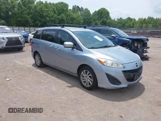 2012 Mazda 5 Sport z VIN JM1CW2BLXC0106748, wystawiony jako IAAI lot #42435965 z przebiegiem 153 786 mil mil oraz . Historia ofert i sprzedaży dostępna na DreamBid. Obrazek 1.