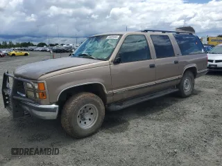 1996 GMC Suburban with VIN 3GKFK16R3TG518236, listed as a Copart auction lot 56580465 with 227,818 mi miles and Salvage title. Bid and sale history available at DreamBid. Image 1.
