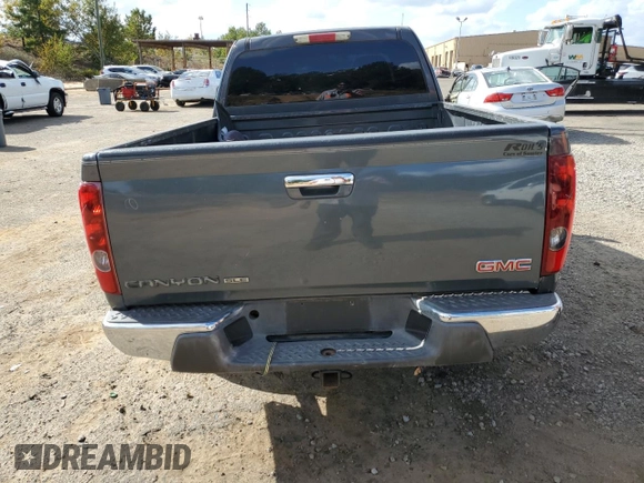 2009 GMC Canyon Work Truck with VIN 1GTDT19E698142512, listed as a Copart auction lot 77493574 with 0 mi miles and Salvage Title. Bid and sale history available at carsss.com. Image 6.
