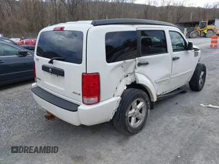2007 Dodge Nitro SXT with VIN 1D8GU28K77W727391, listed as a IAAI auction lot 41869288 with 214,920 mi miles. Bid and sale history available at carsss.com. Image 4.