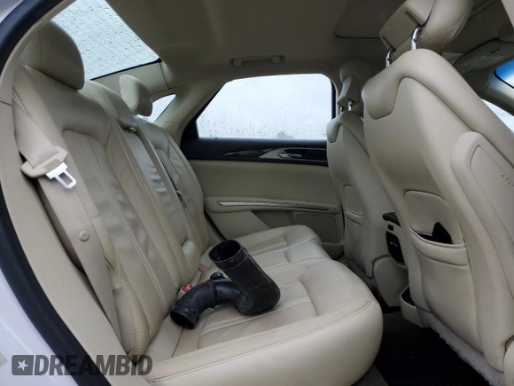 2015 Lincoln MKZ z VIN 3LN6L2J9XFR605027, wystawiony jako Copart lot #57724605 z przebiegiem 76 845 mil mil oraz Czysty tytuł • Clean title. Historia ofert i sprzedaży dostępna na DreamBid. Obrazek 10.