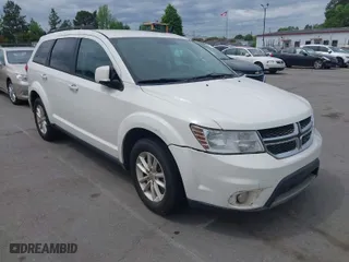 2017 Dodge Journey SXT with VIN 3C4PDCBG4HT572573, listed as a IAAI auction lot 42036006 with 209,854 mi miles. Bid and sale history available at carsss.com. Image 1.