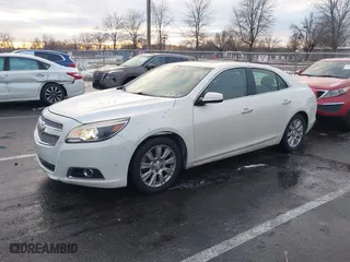 2013 Chevrolet Malibu LTZ with VIN 1G11J5SX7DF208901, listed as a IAAI auction lot 41187677 with 174,734 mi miles. Bid and sale history available at carsss.com. Image 2.