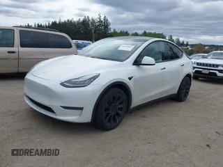 2021 Tesla Model Y Long Range with VIN 5YJYGDEE6MF082883, listed as a IAAI auction lot 42078807 with 64,953 mi miles. Bid and sale history available at carsss.com. Image 2.