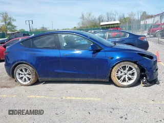 2023 Tesla Model Y Long Range with VIN 7SAYGDEE7PF702051, listed as a IAAI auction lot 42074182 with 50,473 mi miles and . Bid and sale history available at DreamBid. Image 12.