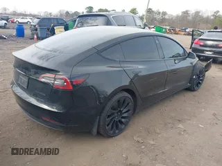 2023 Tesla Model 3 Long Range with VIN 5YJ3E1EB6PF673532, listed as a IAAI auction lot 41885716 with 39,690 mi miles and . Bid and sale history available at DreamBid. Image 4.