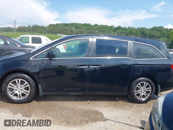 2011 Honda Odyssey EX-L with VIN 5FNRL5H69BB037248, listed as a IAAI auction lot 42613070 with 101,008 mi miles and . Bid and sale history available at DreamBid. Image 14.
