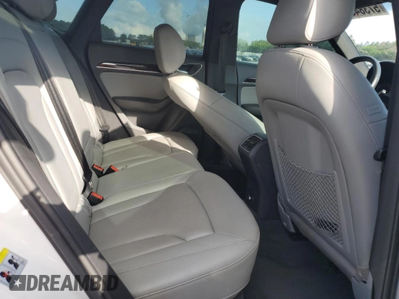 2016 Audi Q3 Prestige with VIN WA1FFCFS0GR007940, listed as a Copart auction lot 57384685 with 61,336 mi miles and Salvage title. Bid and sale history available at DreamBid. Image 11.