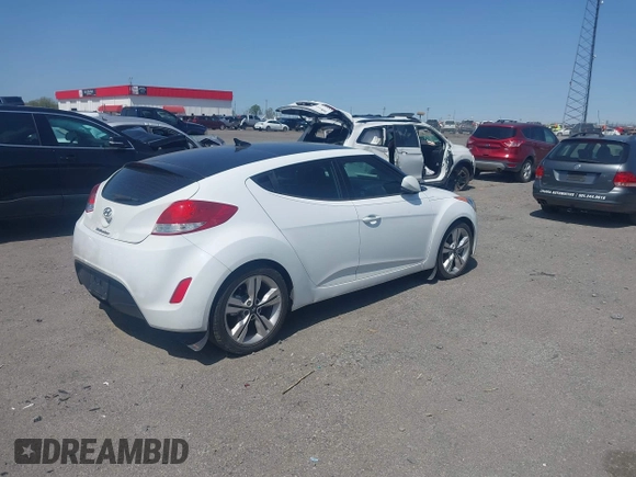 2016 Hyundai Veloster z VIN KMHTC6AD9GU272411, wystawiony jako IAAI lot #41904711 z przebiegiem 133 490 mil mil oraz . Historia ofert i sprzedaży dostępna na DreamBid. Obrazek 4.
