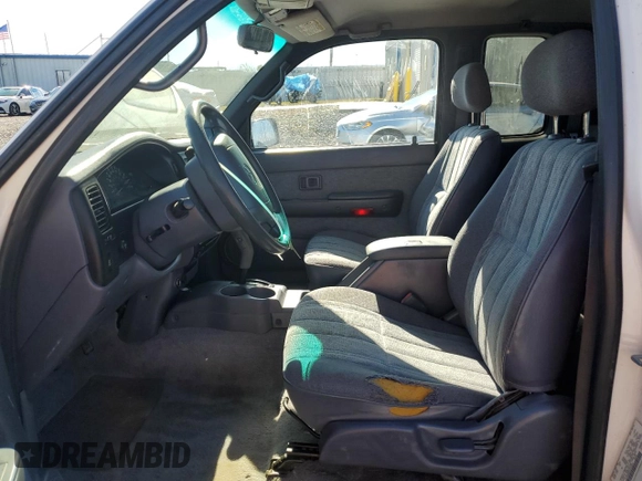 1999 Toyota Tacoma PreRunner with VIN 4TASM92N0XZ559544, listed as a Copart auction lot 86626024 with 209,794 mi miles and Salvage title. Bid and sale history available at DreamBid. Image 7.