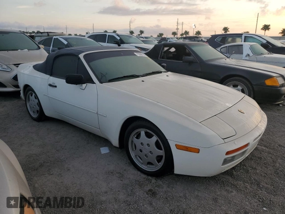1990 Porsche 944 with VIN WP0CB2949LN481351, listed as a Copart auction lot 75335194 with 70,964 mi miles and Salvage title. Bid and sale history available at DreamBid. Image 4.