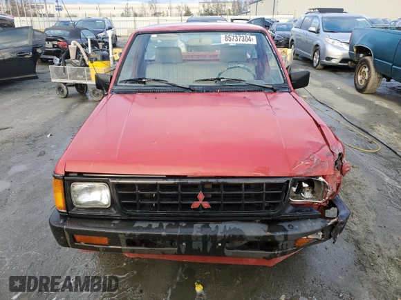 1991 Mitsubishi Mighty Max z VIN JA7FL24W3MP017705, wystawiony jako Copart lot #85737304 z przebiegiem 261 896 mil mil oraz Szkody całkowita. Historia ofert i sprzedaży dostępna na DreamBid. Obrazek 5.