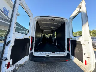2015 Ford Transit Cargo with VIN 1FTNE2CM4FKA17642, listed as a Copart auction lot 71286284 with 664,494 mi miles and Clean Title. Bid and sale history available at carsss.com. Image 12.