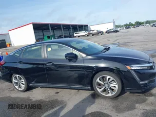2021 Honda Clarity Touring z VIN JHMZC5F3XMC001253, wystawiony jako IAAI lot #42212102 z przebiegiem 35 649 mil mil oraz . Historia ofert i sprzedaży dostępna na DreamBid. Obrazek 13.